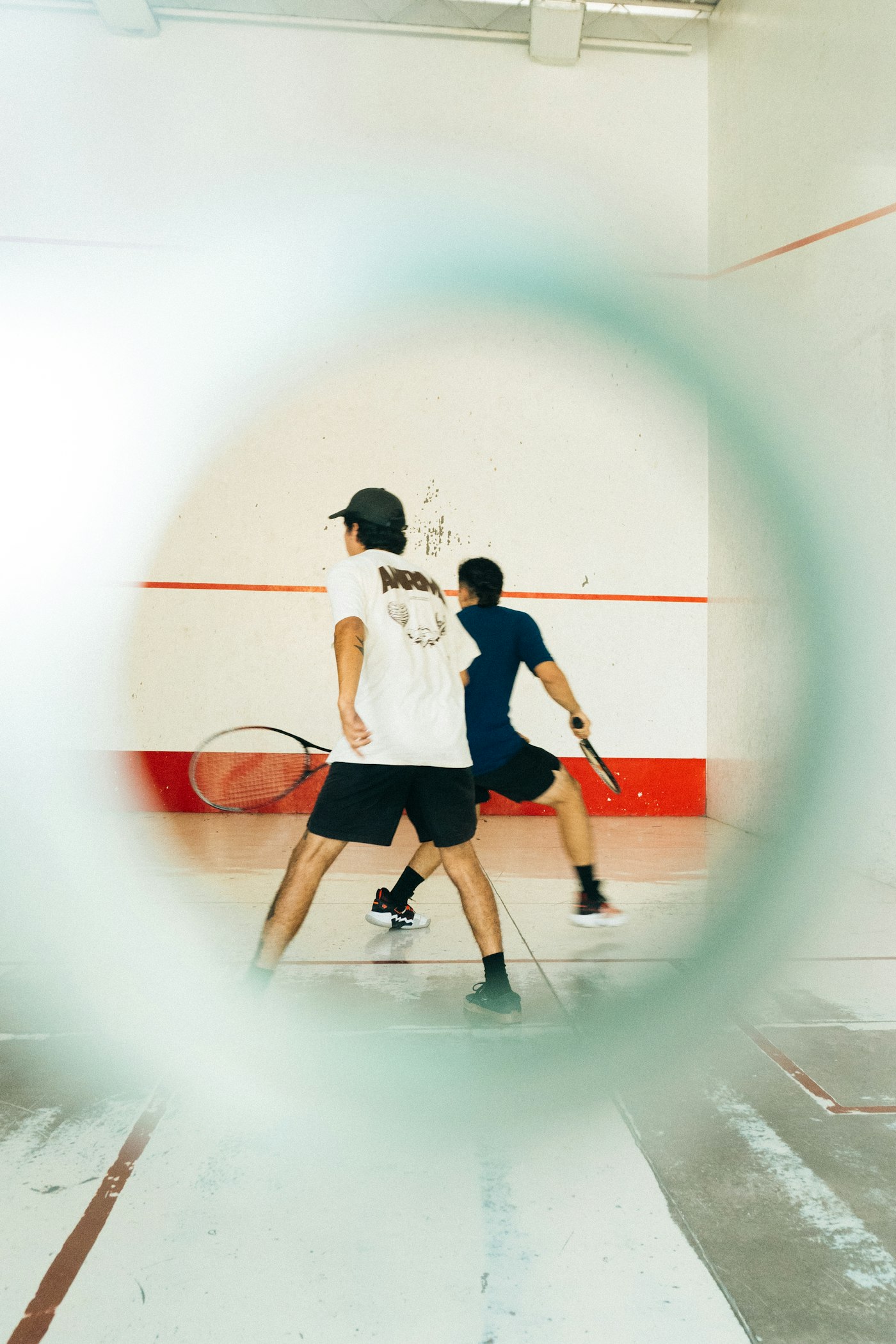Two squash players on court